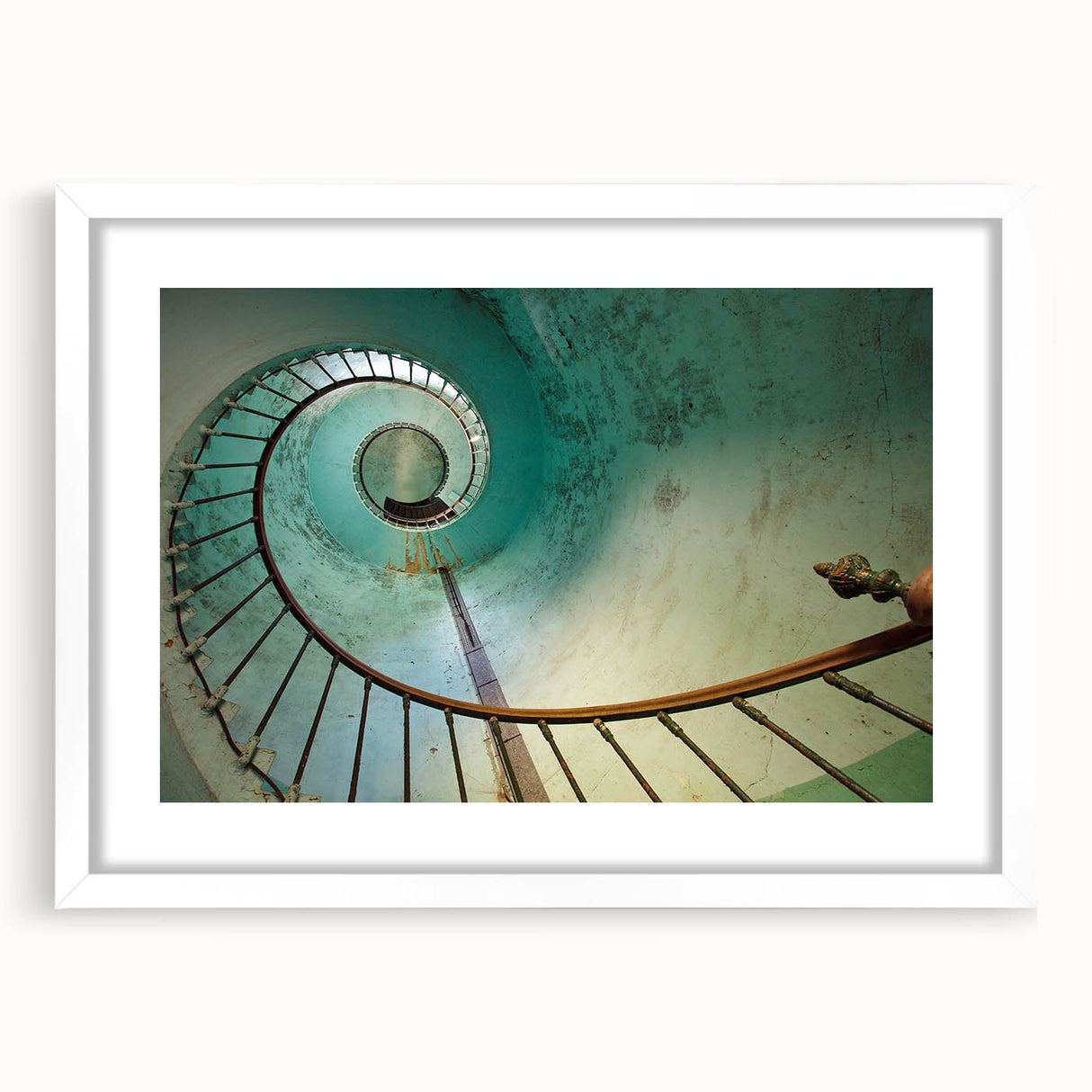 Abstract art print of a spiral staircase in monochrome shades, framed in white, suitable for bedroom or dining room decor.
