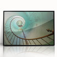 Large abstract wall art featuring a spiral staircase in black and white, framed in acrylic.