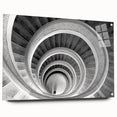 Large abstract wall art of a spiral staircase in muted gray tones on acrylic glass.