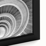 Close-up of a black framed canvas featuring a colorful, textured staircase design.