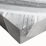 Black and white photograph of a spiraling staircase on stretched canvas, ideal for modern bedroom decor.