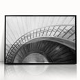 Large abstract wall art of a spiral staircase in black and white, framed acrylic, suitable for modern art wall decor.