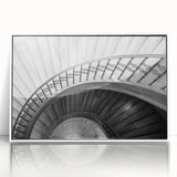 Art Deco poster featuring a spiral staircase design in black and white, framed in acrylic.