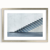 Textured art depicting an abstract spiral staircase in monochrome shades, printed on a framed poster.