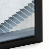 Close-up of a black wall art featuring a textured abstract staircase design on framed canvas.