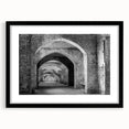Abstract art print featuring colorful, textured tunnels in a black frame, ideal for modern living room decor.
