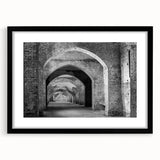 Abstract art print featuring colorful, textured tunnels in a black frame, ideal for modern living room decor.