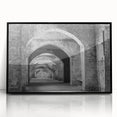 Large abstract wall art of geometric tunnels in black and gray, acrylic print in a black frame.