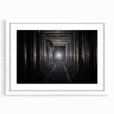 Abstract art print depicting geometric shapes in black and white, framed with a white mat.