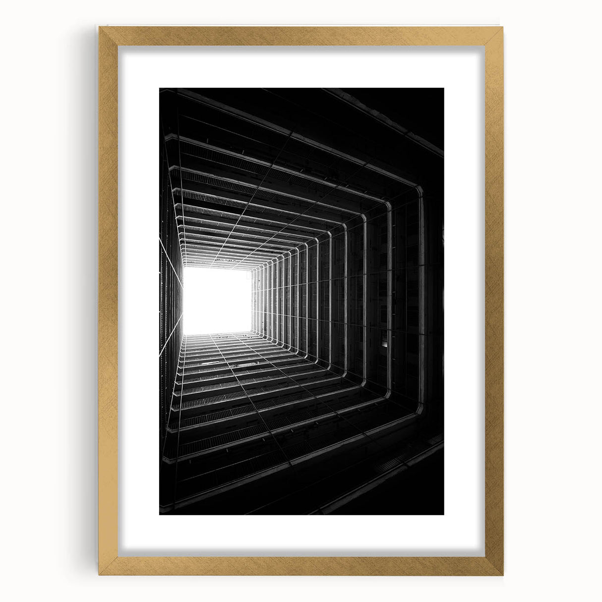 Extra large abstract art print featuring textured, swirling patterns in gold and black, framed with a gold mat.
