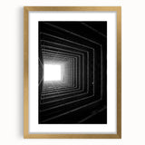Extra large abstract art print featuring textured, swirling patterns in gold and black, framed with a gold mat.