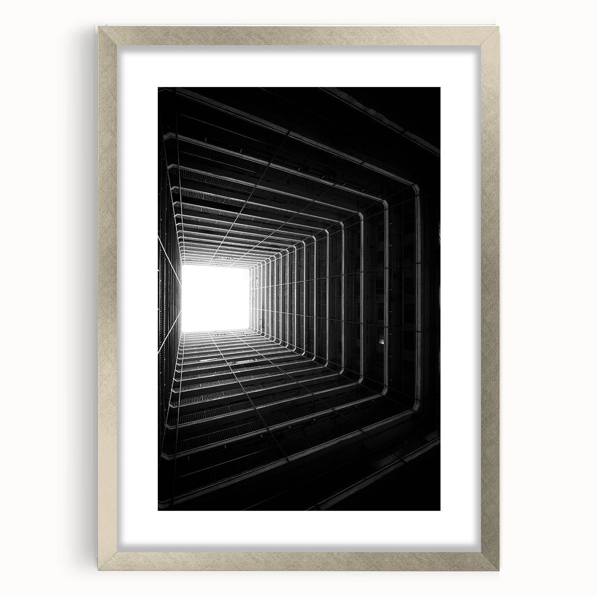 Textured abstract art print in muted gray and silver tones, framed with a silver mat, suitable for bedroom decor.