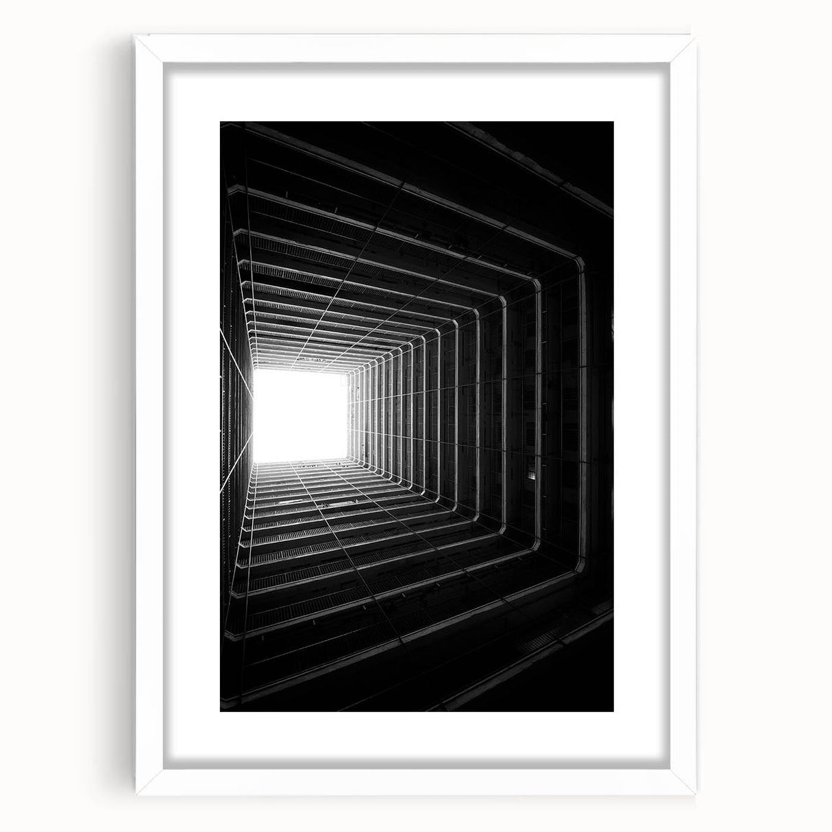 Abstract art print featuring swirling black and white patterns on a framed canvas, ideal for dining room decor.