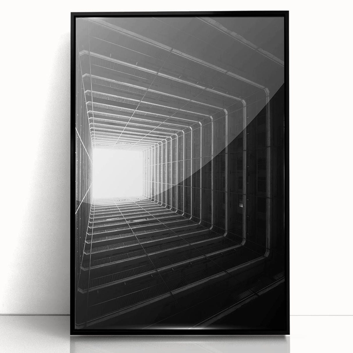 Large abstract wall art featuring geometric shapes in black and white, framed in black acrylic.
