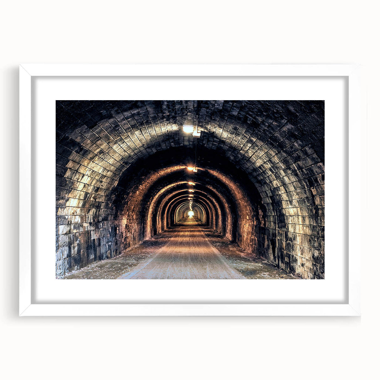 Abstract art print depicting overlapping tunnel designs in muted gray tones on a framed white mat.