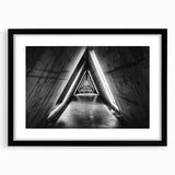 Extra large abstract art print featuring colorful, textured tunnels, framed in black, ideal for living room decor.