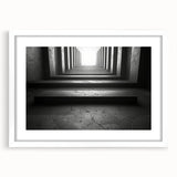 Abstract art print featuring swirling black and white tunnel design on a framed poster.