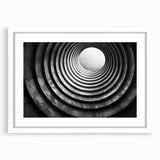 Abstract art print of intertwining tunnels in muted gray, ideal for modern dining room decor, framed with a white mat.