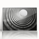 Art deco poster featuring symmetric tunnel architecture in black and white, acrylic framed.