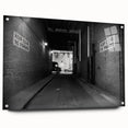 Large abstract wall art on acrylic glass depicting a monochrome architectural tunnel.