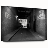 Large abstract wall art on acrylic glass depicting an architectural tunnel in monochrome gray.