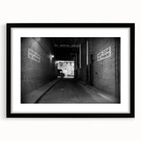 Extra large abstract art print featuring a colorful, textured tunnel design on a black framed canvas.