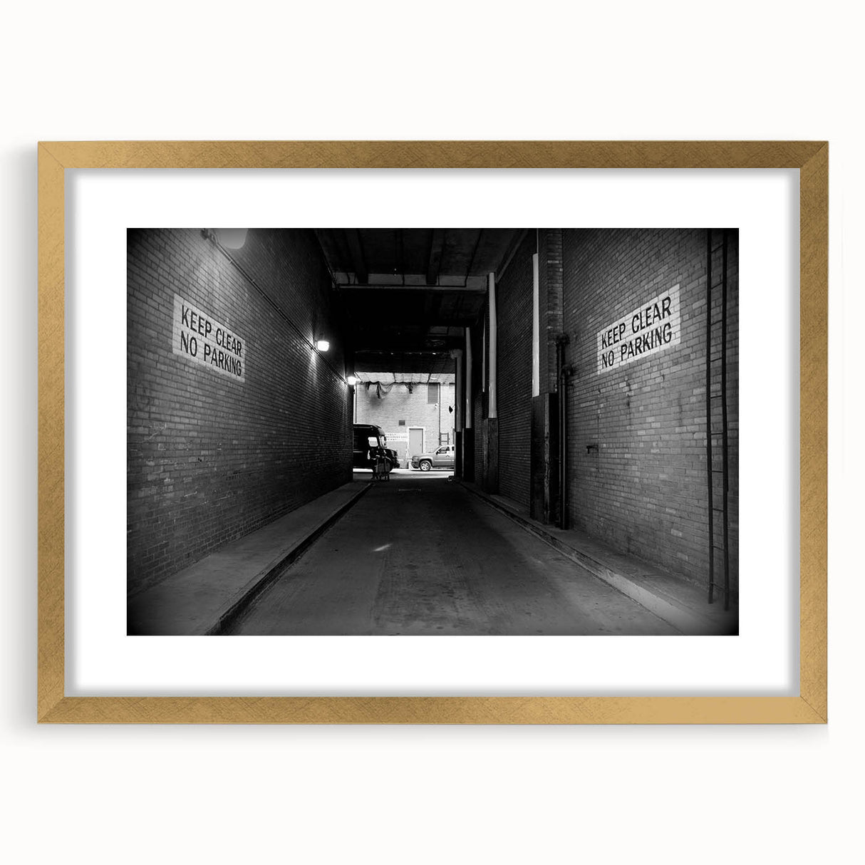 Extra large abstract art print of architectural tunnels in textured gray tones on a gold-framed canvas.