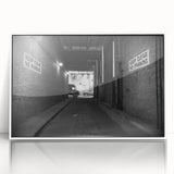 Art deco poster of geometric tunnels in black and white, acrylic framed, ideal for modern art wall decor in a nursery.
