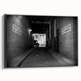 Black and white framed canvas of a vintage poster featuring architectural tunnels, ideal for bedroom wall decor.