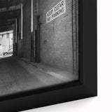 Extra large framed canvas featuring a textured, black tunnel design with colorful art accents, ideal for living room decor.