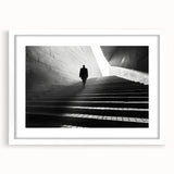 Abstract art print featuring swirling tunnel designs in monochrome, framed in white.