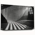 Large abstract wall art featuring a tunnel design in muted grays and blues on acrylic glass.