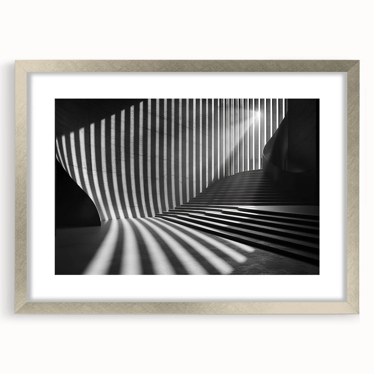 Textured abstract art print in muted gray and silver tones, framed with a silver mat, ideal for modern bedroom ambiance.