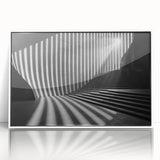 Art deco poster of geometric tunnels in black and white, acrylic framed, suitable for modern nursery decor.