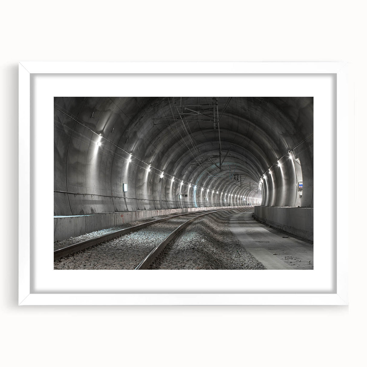Abstract art print featuring interlocking tunnels in gray tones, framed with a white mat.