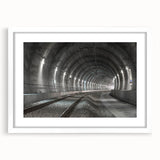 Abstract art print featuring interlocking tunnels in gray tones, framed with a white mat.