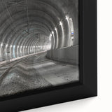 Close-up of a black textured wall art featuring colorful abstract designs on a framed canvas.
