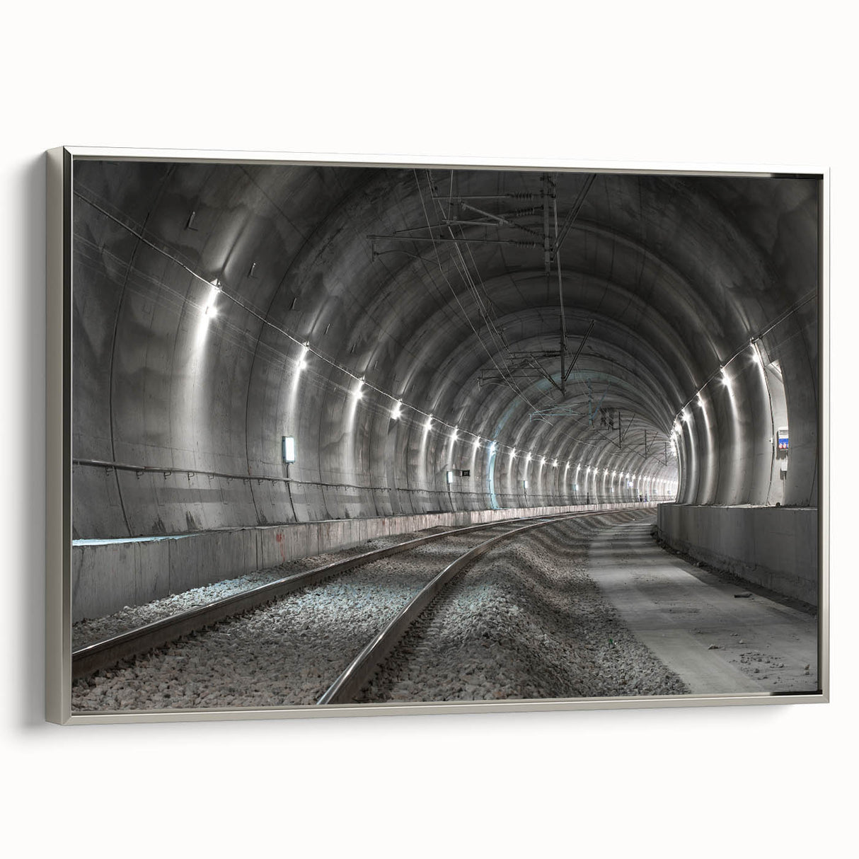 Framed canvas displaying a vintage-style landscape with a tunnel in muted silver and black tones, ideal for office decor.