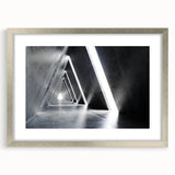 Abstract textured art print in silver frame, featuring overlapping tunnel designs in neutral tones.