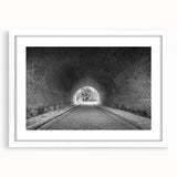 Abstract art print featuring geometric shapes in muted gray and blue tones on a framed white canvas.