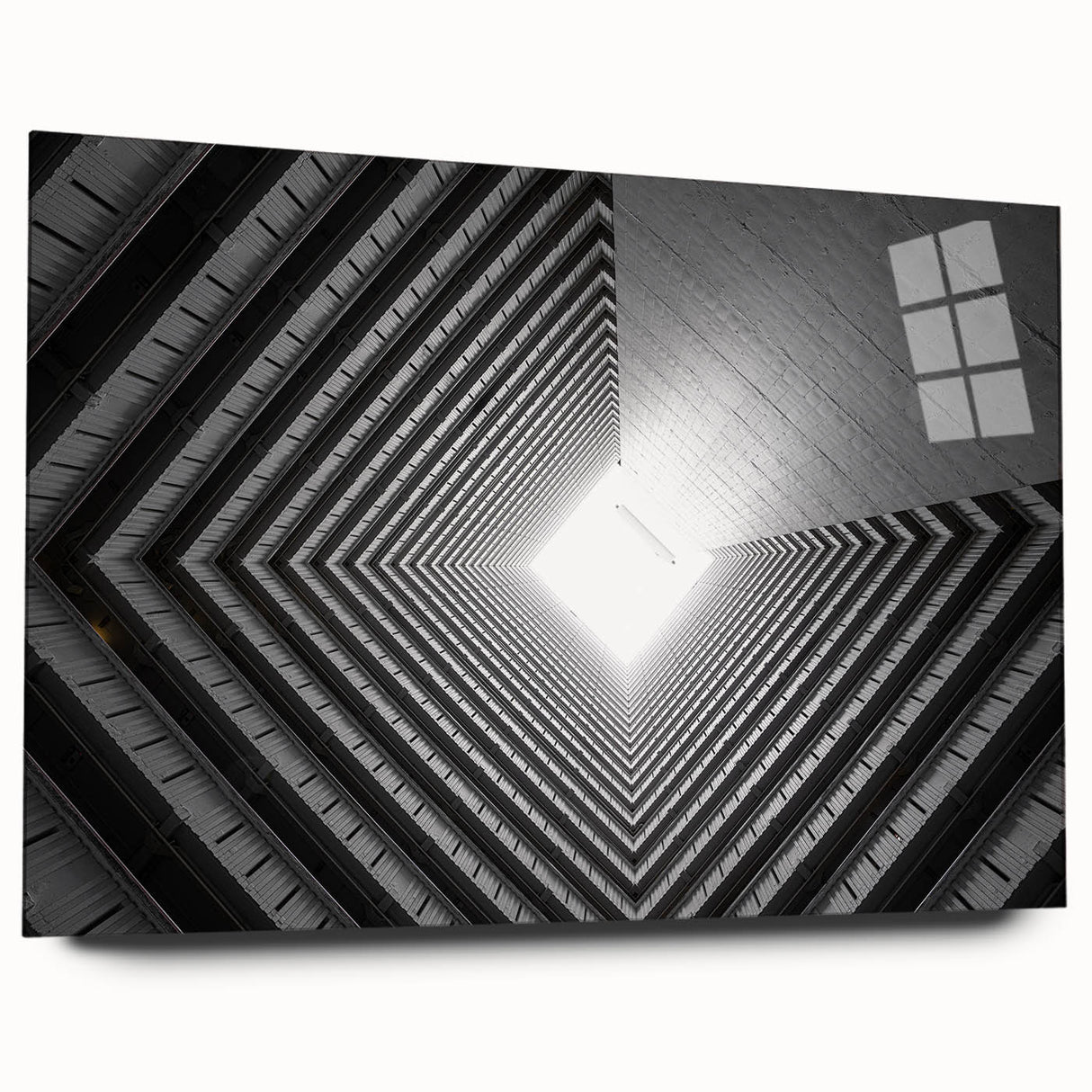 Large abstract wall art on acrylic glass depicting a tunnel design in gray tones, ideal for bedroom or dining room ambiance.