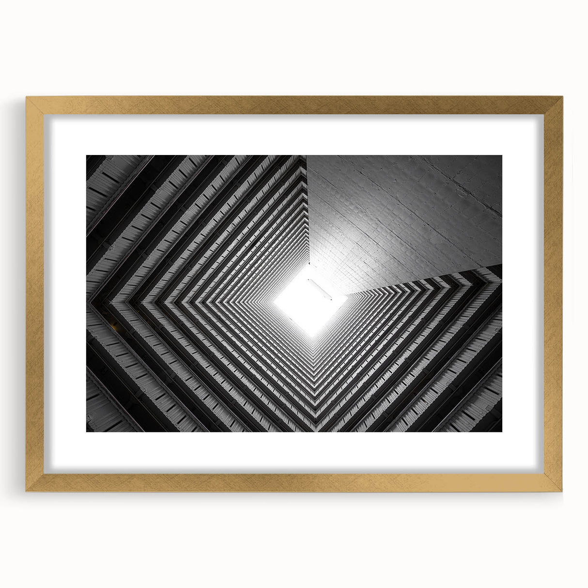 Extra large abstract art print featuring textured lines in muted gold, framed with a gold mat, ideal for living room decor.