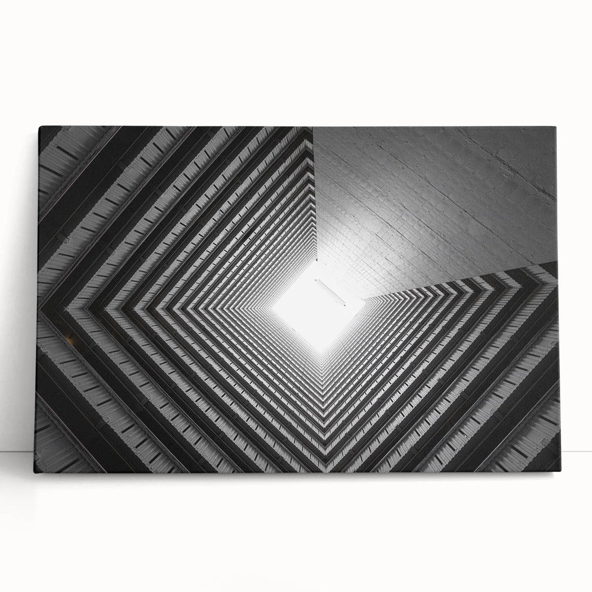 Black and white photo of architectural tunnels on stretched canvas.