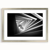 Textured abstract art print in silver frame, featuring swirling gray and white patterns, ideal for bedroom wall decor.