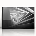 Large abstract wall art featuring overlapping geometric tunnels in black and gray tones on framed acrylic.