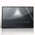 Large abstract wall art featuring a mid-century modernist tunnel design in black and gray tones on framed acrylic.