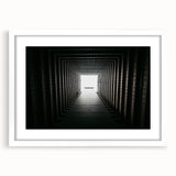 Abstract art print featuring geometric shapes in black and white, framed with a white mat.