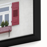 Close-up of black wall art featuring a textured, colorful abstract design on a large framed canvas.