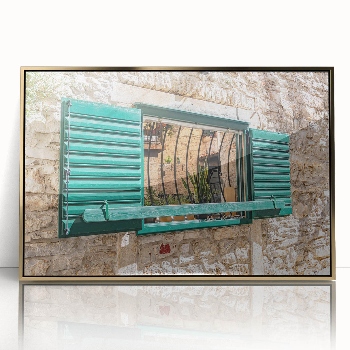 Mid-century modernist art of geometric patterns in gold and black on an acrylic framed poster.