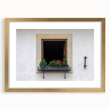 Textured art depicting abstract designs in gold and cream tones on a framed canvas, suitable for bedroom decor.
